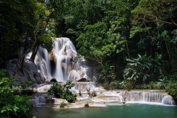 Fototapeta na wymiar Beautiful crystal clear waterfall at Kuang Si Wasserfall at Luang Prabang, Laos PDR, South East Asia. High quality photo