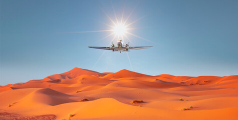 Beautiful sand dunes in the Sahara desert - Sahara, Morocco - Vintage type old metallic propeller airplane in the sky - obrazy, fototapety, plakaty