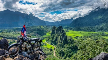 Fotobehang Motorbike on Top of Nam Xay Mountain, Vang Vieng, Laos PDR, South East Asia. High quality photo © SimonMichael