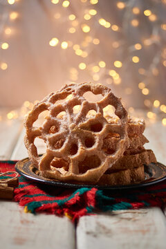 Typical Mexican Christmas sweet called "Bu&ntilde;uelo de viento" or Culler. Selective focus.