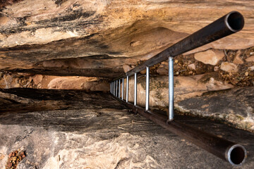 Ladder Drops Into A Narrow Slot Canyon Down To Peekaboo Spring