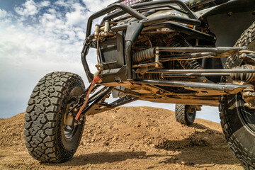 Fototapeta na wymiar front of all terrain vehicle, ATV, with a winch in a desert