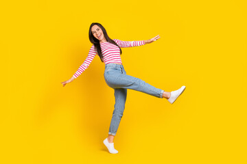 Full length photo of joyful sweet lady good mood free time relax rest big black friday sale empty isolated on yellow color background