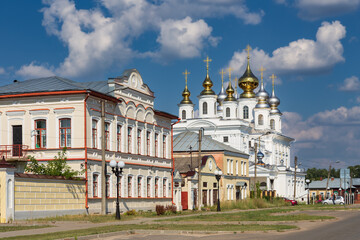Fototapeta na wymiar Historical center of Russian town with old buildings and Orthodox cathedral in daylight Shuya Russia