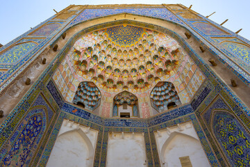 Colorful entrance to ancient religious building with traditional decoration, Bukhara, Uzbekistan