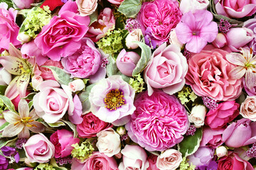 Delicate blooming festive light pink roses and bright flowers, blossoming rose flower background, bouquet floral card, selective focus, shallow DOF	