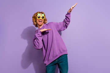 Photo of funky beard millennial guy dance wear spectacles hoodie isolated on purple color background