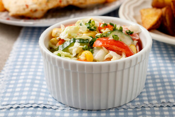 A bowl with vegetable salad.