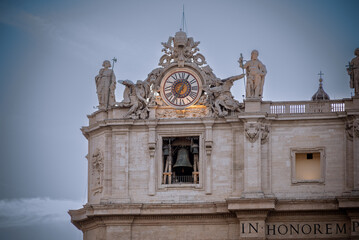 Clock on the Facade of the Basilic of Saint Peter in the Vatican City in the Centre of Rome