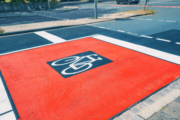 Cyclists dedicated lane and bike path painted on asphalt of the streets of the city. Alternative...