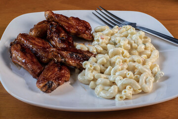 honey barbecue wings served with macaroni salad