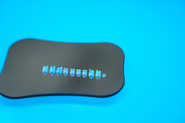 Photo of ceramic sapphire braces for teeth alignment. Modern dentistry