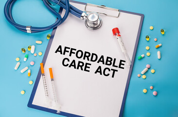 Words Affordable Care Act ACA Tablet. Stethoscope, paper with Affordable Care Act ACA text on the...