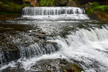 Waterfall splashing and moving water in the nature park