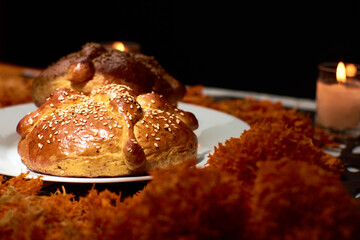 Bread of the dead cempasúchil flowers were used around it and candles were placed to set the scene, confetti was also placed