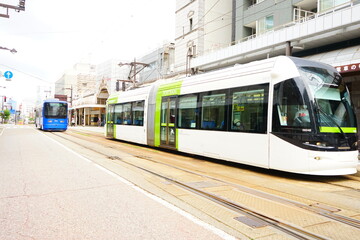 Naklejka na ściany i meble Tram at Toyama Station in Toyama, Japan - 日本 富山県 富山駅 市電