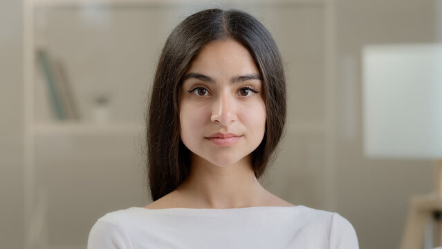 Portrait elegant beauty model female sensual attractive gorgeous lady feminist young woman slim cute girl with purity clear skin natural makeup serious facial emotion looking at camera posing indoors