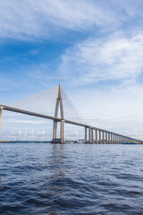 View of Amazonas landscape with Rio Negro Bridge or Ponte Rio Negro, Journalist Phelippe Dahsou Bridge near Manaus in Brazil, Amazonas with blue sky