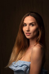 Fototapeta premium portrait of a young attractive woman on a dark background