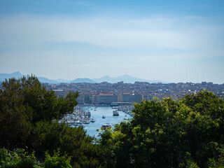 Fototapeta na wymiar Marseille, France - May 15th 2022: View towards the city centre with the old harbour