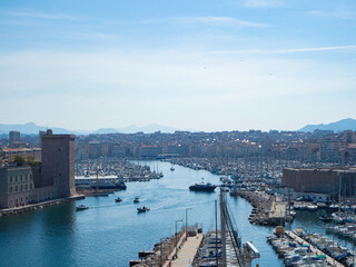 Fototapeta na wymiar Marseille, France - May 15th 2022: Entrance towards the historic harbour