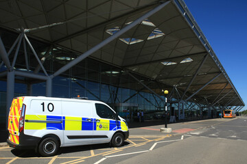Police van outside passenger terminal building, London Stansted Airport, Stansted, Essex, England, UK