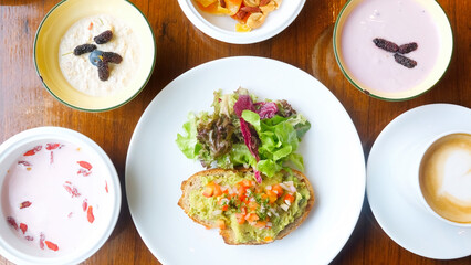 Healthy eating food with fresh avocado toast, muesli and superfood
