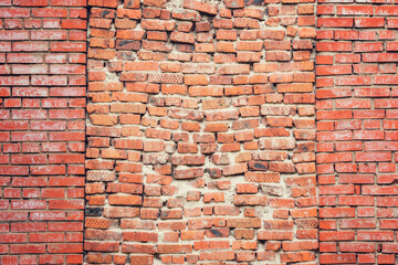 Ancient red brick wall background.