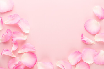 Naklejka na ściany i meble Rose flowers petals on pastel background. Valentines day background. Flat lay, top view, copy space.