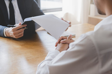 Asian young manager, employer man interview with person, have question about resume and listen to...