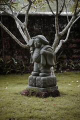 Stone-carved Statue of Ebisu. Ebisu is a Japanese god of luck, wealth, and prosperity.
