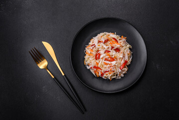 A delicious fresh vegetarian salad of white cabbage, carrot and paprika