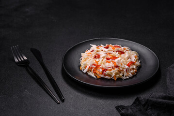 A delicious fresh vegetarian salad of white cabbage, carrot and paprika