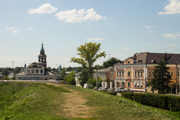 Fototapeta na wymiar Yuryev-Polsky, Vladimir Region, Russia - August, 17, 2022: old town with church, bell tower and historical mansions on a sunny summer day