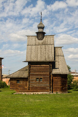 Yuryev-Polsky, Vladimir Region, Russia - August, 18, 2022: wooden old St. George's Church in the monastery in the old town on a clear sunny summer day against the blue sky
