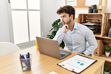 Young hispanic businessman concentrate working at the office.