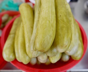 Close up of pickled cucumbers on sale at local famers market.