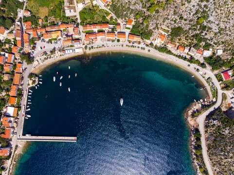 aerial view of the wonderful mediterranean bay of the peljesac peninsula; paradise beach with turquoise water and rocky coastline; aerial view of the town of trstenik in croatia