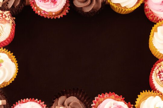 muffins cupcakes on a wooden background high-quality photos for calendar and cards. Space for text