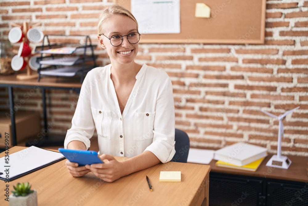 Sticker young blonde woman business worker using laptop and touchpad at office