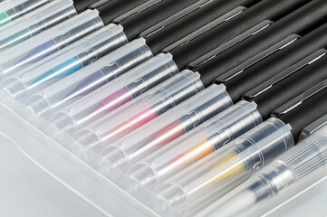 A set of new multi-colored brushes on a white background. Close-up.
