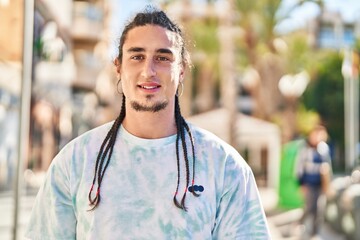 Young man smiling confident standing at street