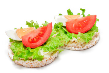 Rice Cake Sandwiches with Tomato, Lettuce and Egg - Isolated on White. Easy Breakfast. Diet Food. Quick and Healthy Sandwiches. Crispbread with Tasty Filling. Healthy Dietary Snack - Isolation