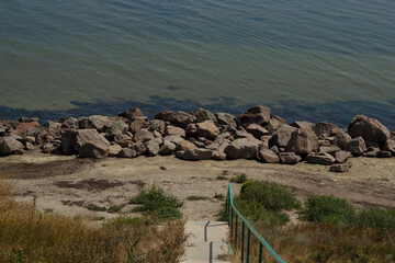 Fototapeta premium Stairs leading to the sea. Rocky coast of the Sea of Azov.