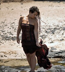 woman walking on the beach slow