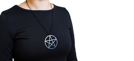 Woman in black wearing a pentagram necklace