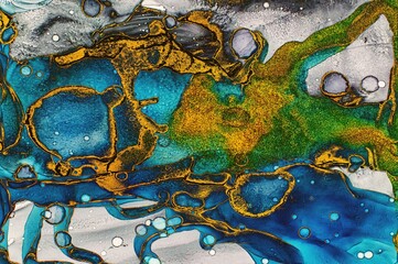 Gold dust filled in many areas of Alcohol ink fluid abstract texture fluid art with gold glitter and liquid.
