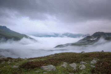 Fototapeta na wymiar Mountains and foggy weather with low clouds. Soft focus.