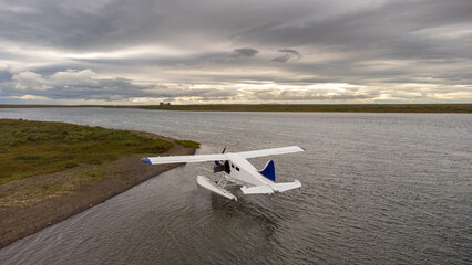 Float plane or bush plane floating on the Egegik river in Alaska. 