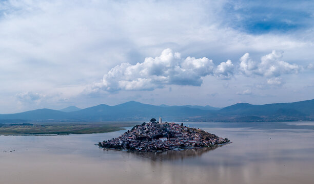 Aerial: epic view of the Island of Janitzio in Patzcuaro, Michoacan, Mexico. Drone view